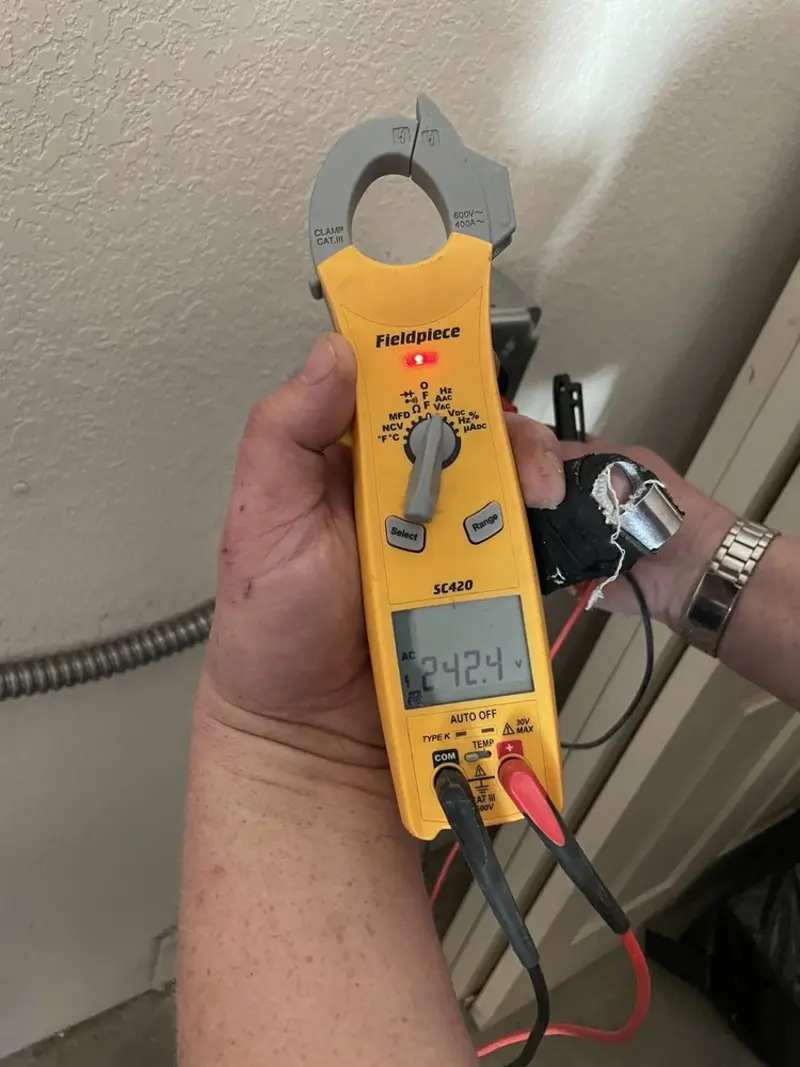 Voltage testing with clamp meter during Recessed Lighting Installation in Apache Junction